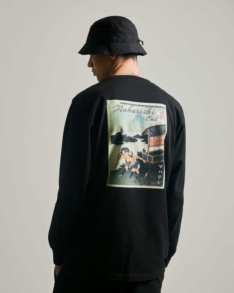 A model facing away from the camera wears the END. x Maharishi &quot;Postal Service&quot; Hikyaku Courier Longsleeve T-shirt