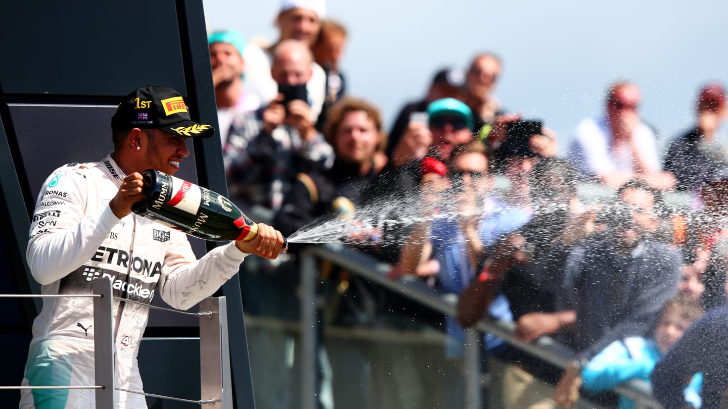 NORTHAMPTON, ENGLAND - JULY 05:  Lewis Hamilton of Great Britain and Mercedes GP celebrates on the