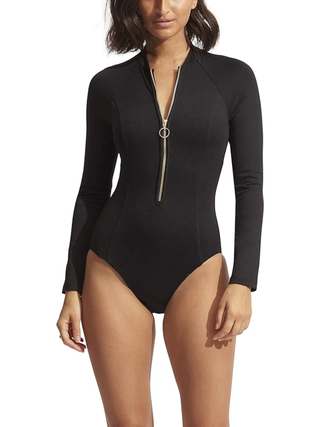 Woman in black long sleeve swimsuit