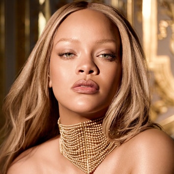 Rihanna embodies the iconic J'adore Dior perfume bottle in a golden corset dress