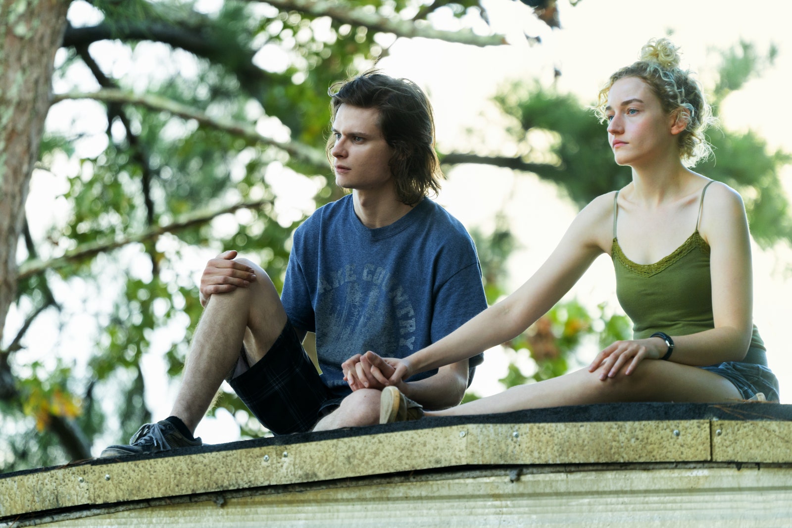 Image may contain Julia Garner Human Person Clothing Apparel Shoe Footwear Charlie Tahan Shorts and Finger