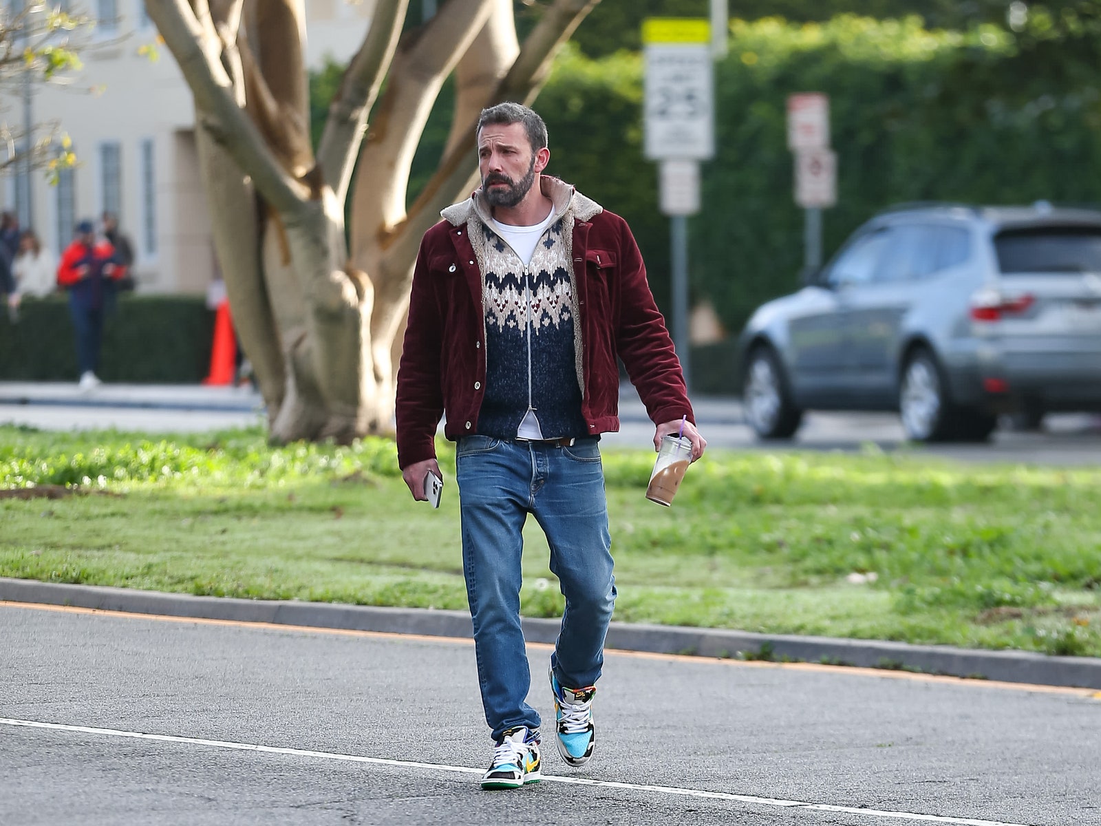 Ben Affleck wearing the Ben amp Jerry's x Nike SB Dunk Low ‘Chunky Dunky