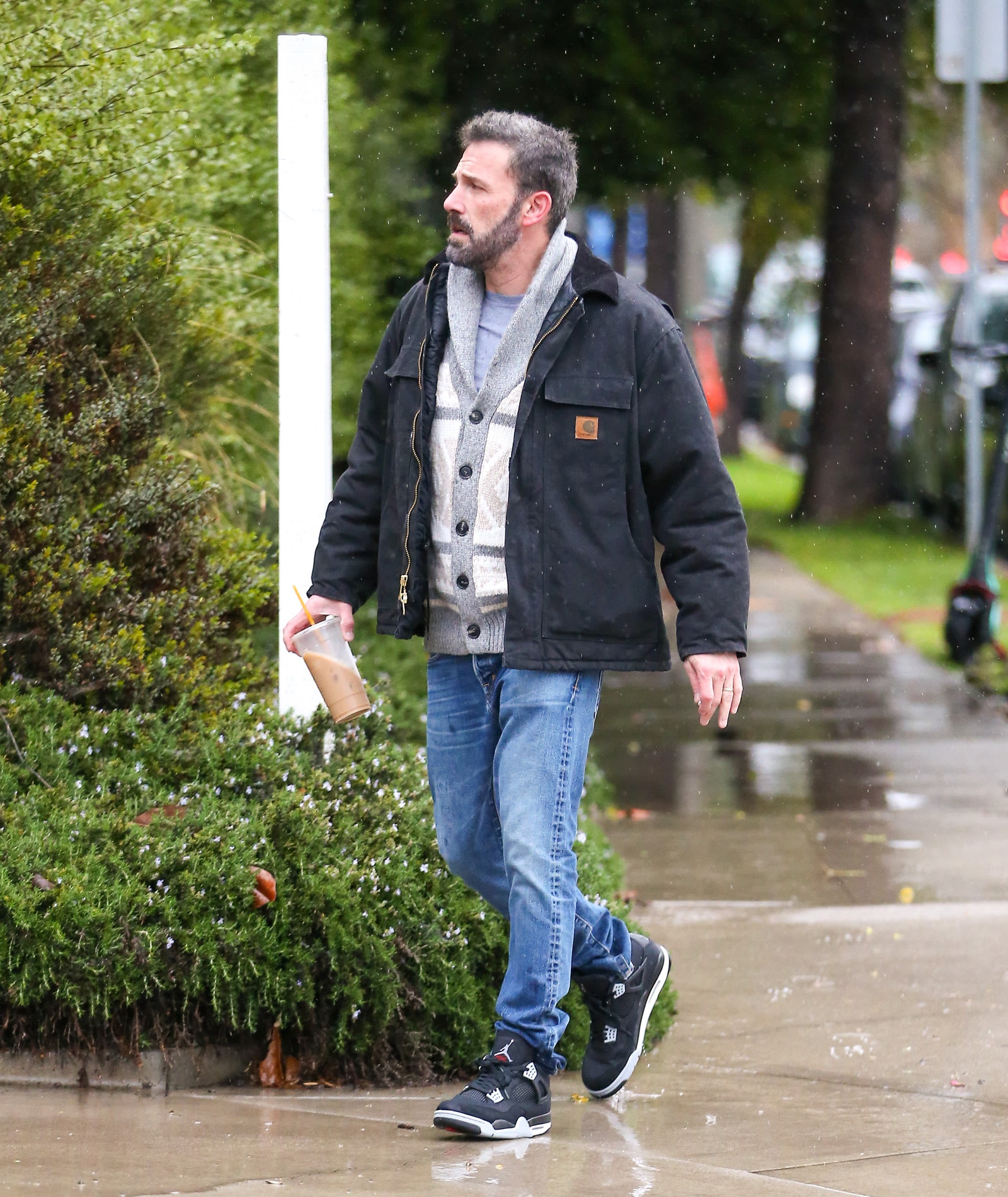 Ben Affleck wearing the Air Jordan 4 SE ‘Black Canvas