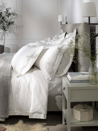 Image may contain Cushion Home Decor Pillow Furniture Rug Bed Linen Book Publication and Lamp