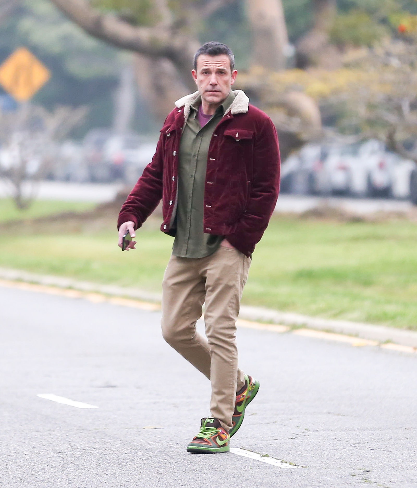 Image may contain Ben Affleck Pedestrian Person Walking Adult Clothing Footwear Shoe and Pants