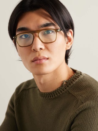 Image may contain Head Person Face Accessories Glasses Adult Body Part Neck Clothing Knitwear and Sweater