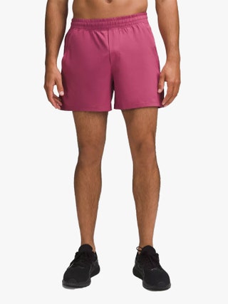 Image may contain Clothing Shorts Adult Person Swimming Trunks Footwear and Shoe