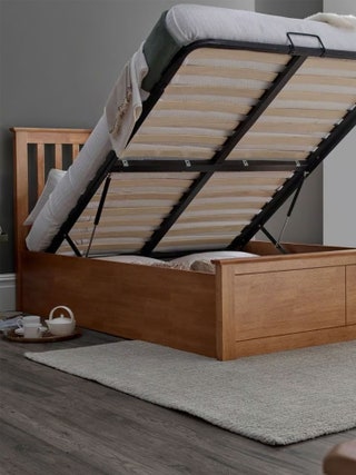 Image may contain Wood Furniture Hardwood Crib Infant Bed Stained Wood Home Decor and Rug