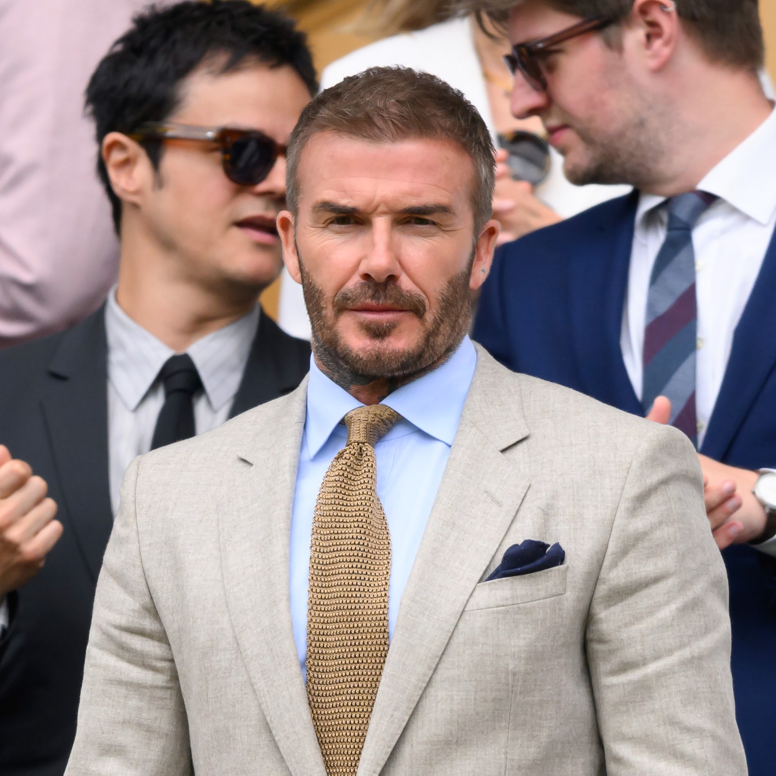 At Wimbledon, David Beckham had a perfect suit for a summer of mixed signals