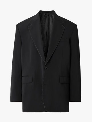 Image may contain Clothing Formal Wear Suit Coat Tuxedo Jacket and Blazer