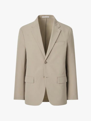 Image may contain Blazer Clothing Coat Jacket Formal Wear Suit and Khaki