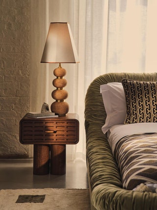 Image may contain Lamp Couch Furniture Home Decor Rug and Floor Lamp