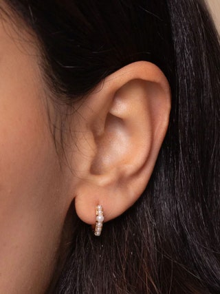 Image may contain Accessories Earring Jewelry Adult Person Body Part and Ear