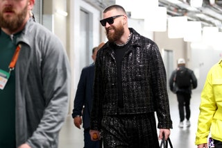 Kansas City Chiefs tight end Travis Kelce headed into the big game last night in a custom sequinembellished boucl jacket...