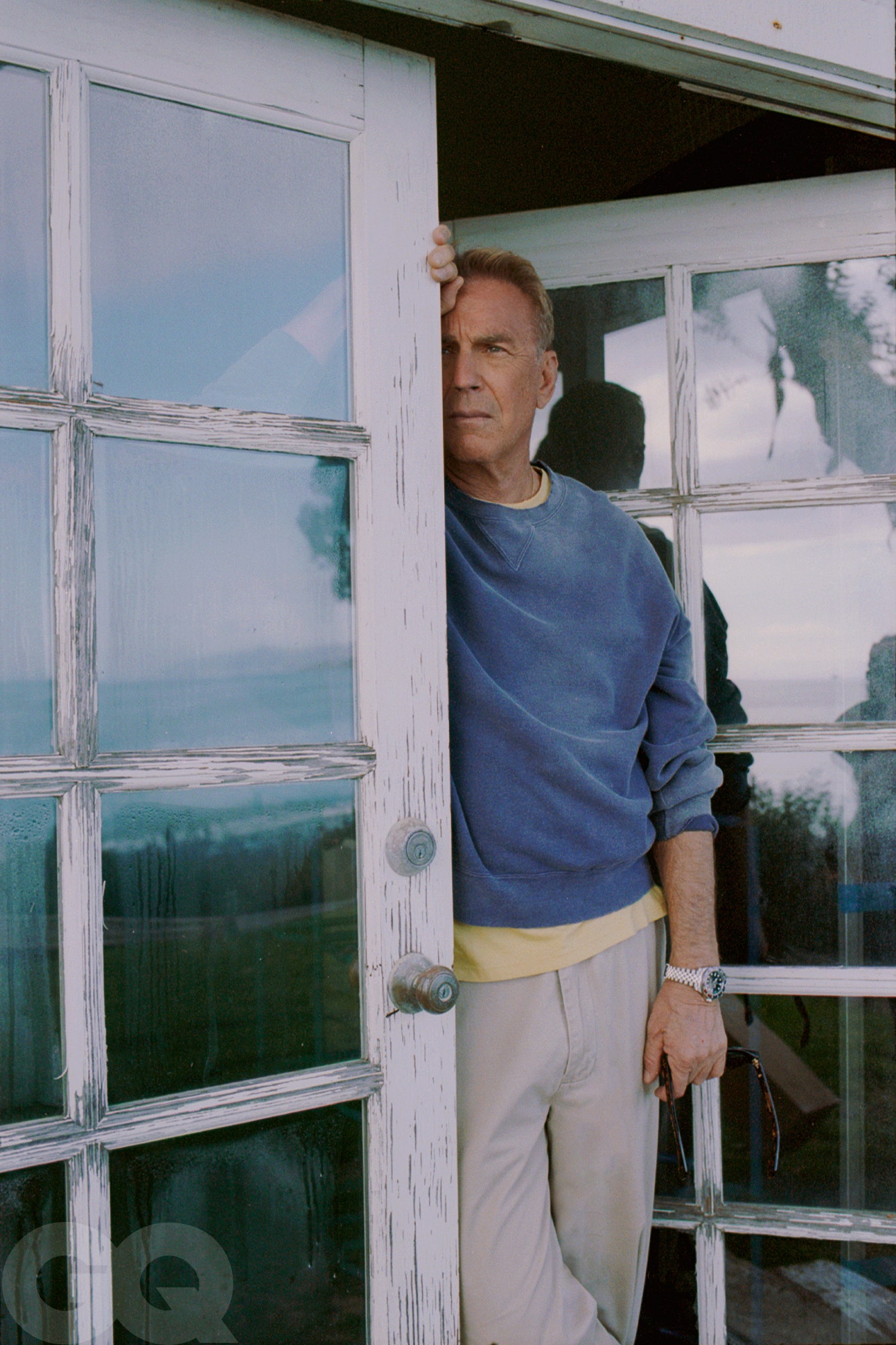 Image may contain Kevin Costner Yellowstone Horizon Door Wristwatch Adult Person Architecture Building Housing and House