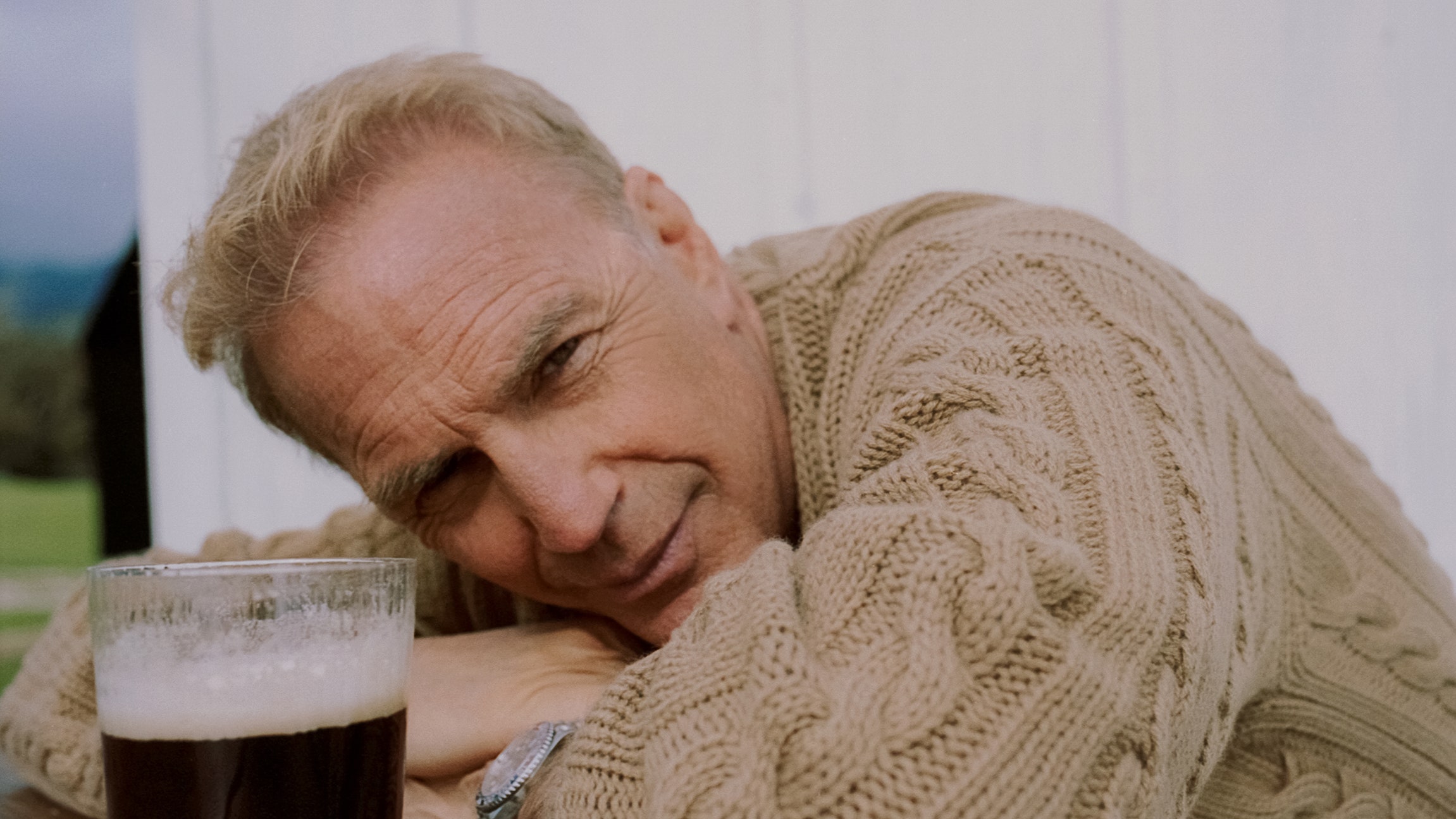 Image may contain Kevin Costner Yellowstone Horizon Alcohol Beer Beverage Cup Person Glass Head Photography Face and...