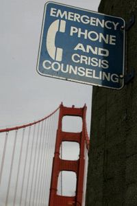 A sign marking the spot of a crisis counseling phone.