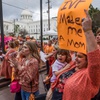 Veronica Wehby-Upchurch holds a sign and son Ladner Upchurch as hundreds gather for a rally for in vitro fertilization legislation Wednesday, Feb. 28, 2024, in Montgomery, Ala. 