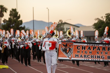 Gladiola Jimenez, head drum major for the Chaparral High School marching band, looks to the crowd of family and friends gathered to watch during the last practice Monday July 1, 2024, before heading to Washington DC to play at the national July 4th parade.