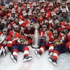 The Florida Panthers team poses with the Stanley Cup trophy after defeating the Edmonton Oilers in Game 7 of the NHL hockey Stanley Cup Final, Monday, June 24, 2024, in Sunrise, Fla. The Panthers defeated the Oilers 2-1.