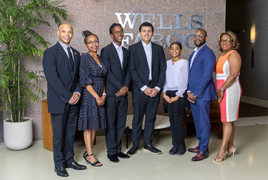 Students and officials pose in the lobby of the Wells Fargo Bank tower Tuesday, July 2, 2024. From left are: Wendell Blaylock, public affairs for Wells Fargo Nevada and Utah, Fineza Tangua, diverse segment leader for Wells Fargo Western Division, Pharaoh Washington, Ross Graydon, Keilana Stephenson, Kirk Richards, instructor for the 100 Black Men of Las Vegas Junior Investor Club, and Rhonda Nolen, program manager for 100 Black Men of Las Vegas.