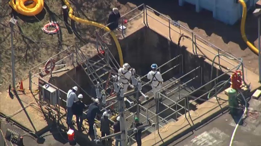 Workers at Trinseo's Bristol facility after a chemical spill into the Delaware River.