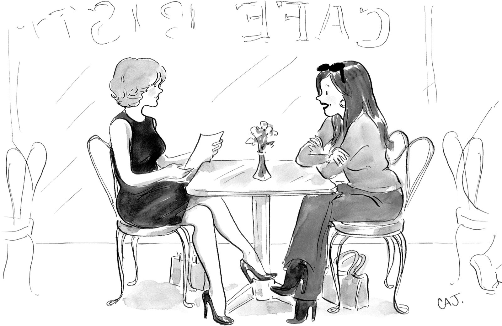 Two women sitting together at a caf bistro table.