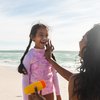 Purchased - Parent putting sunscreen on child