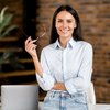 Purchased - Woman standing with glasses in hand