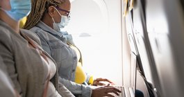 Purchased - Woman working on a plane with a mask on