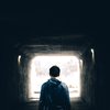 Man standing in tunnel