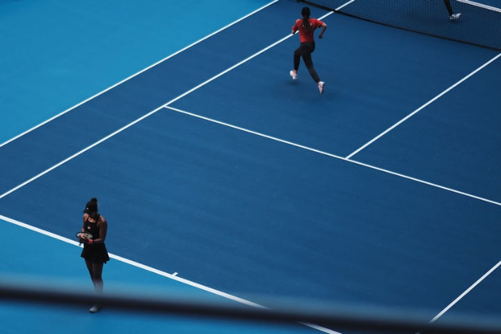 A Couple Playing Tennis