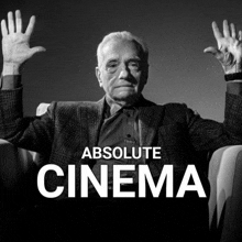 a black and white photo of a man with his hands in the air and the words absolute cinema above him