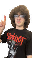 a man wearing glasses and a slipknot t-shirt points up