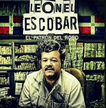 a man sitting in front of a sign that says " leonel escobar "