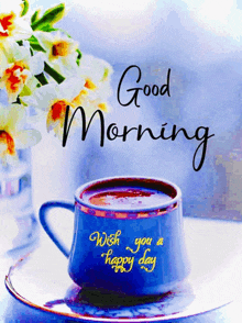 a cup of coffee on a saucer with the words good morning wish you a happy day