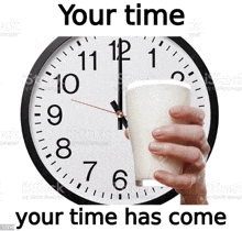 a person is holding a cup of milk in front of a clock that says your time has come