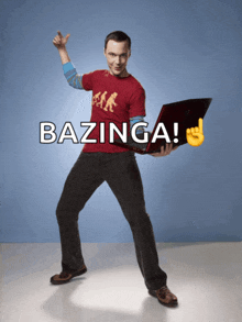 a man in a red shirt is holding a laptop with the words bazinga written above him