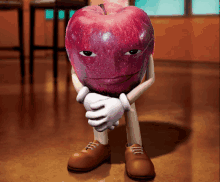 a red apple with arms and legs is sitting on a wooden floor