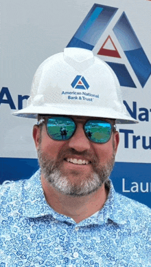 a man wearing a hard hat that says american national bank & trust on it