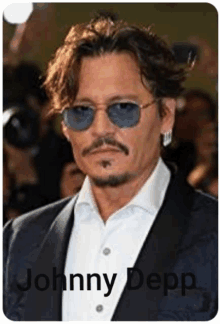 a picture of johnny depp wearing sunglasses and earrings