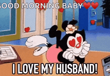 a cartoon character is saying `` good morning baby i love my husband '' while sitting on a table .