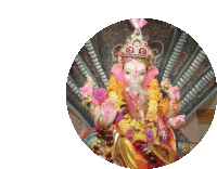 a colorful statue of a deity with a crown