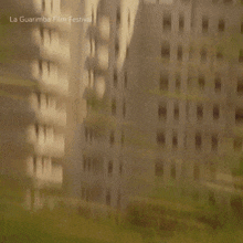 a man and a woman are sitting next to each other and the words la guarimba film festival are visible