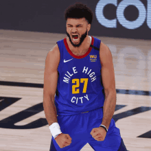 basketball player wearing a blue jersey that says mile high city on it