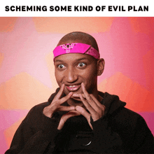 a man with a pink bandana on his head making a funny face with the words scheming some kind of evil plan below him