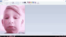 a computer screen with a picture of a boy 's face