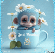 a picture of a monkey in a cup with flowers and the words good morning