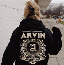 a woman wearing a hoodie that says it 's an arvin thing