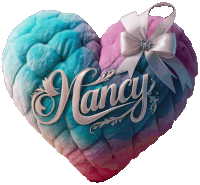 a colorful heart shaped pillow with the name nancy on it